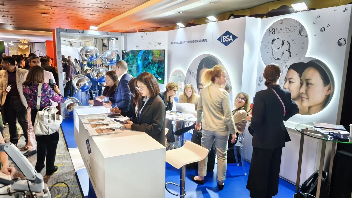 Visitors at a branded congress booth