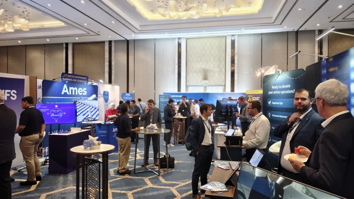 Delegates networking between booths